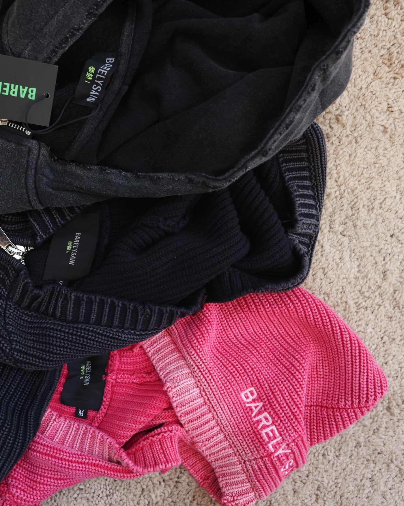 Barelysain knitwear flat-lay with hangtags